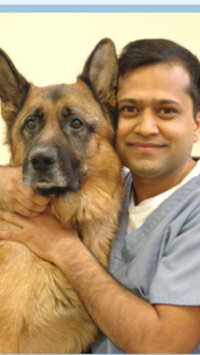 Dr. Shikher Singla with his arm around Shamu, his German Shepherd